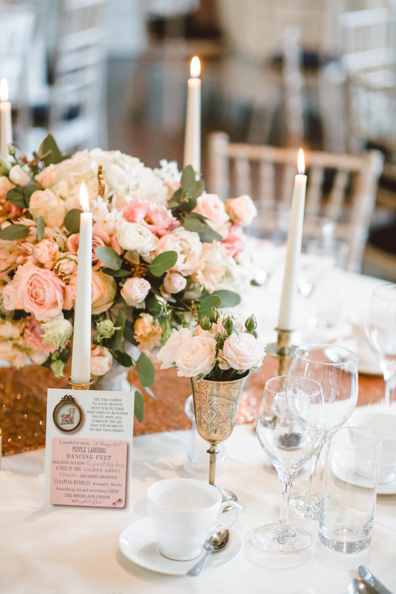 Candlelit reception tables in a grand New York City wedding venue
